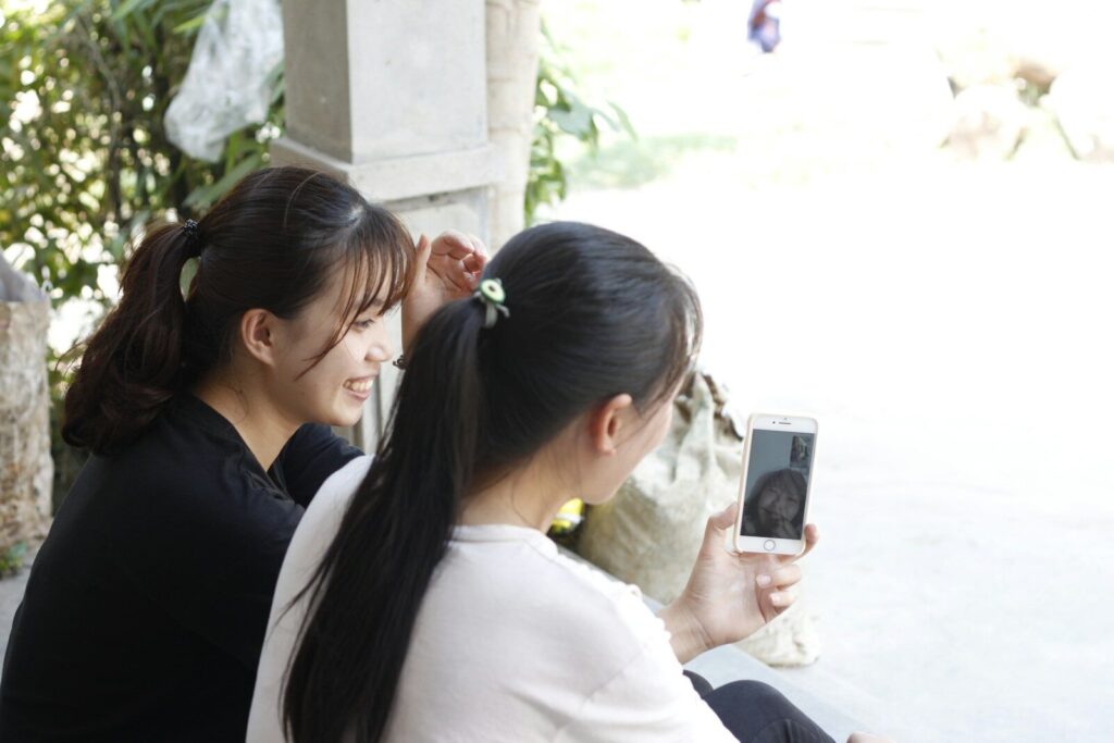Two young women are taking a selfie together.