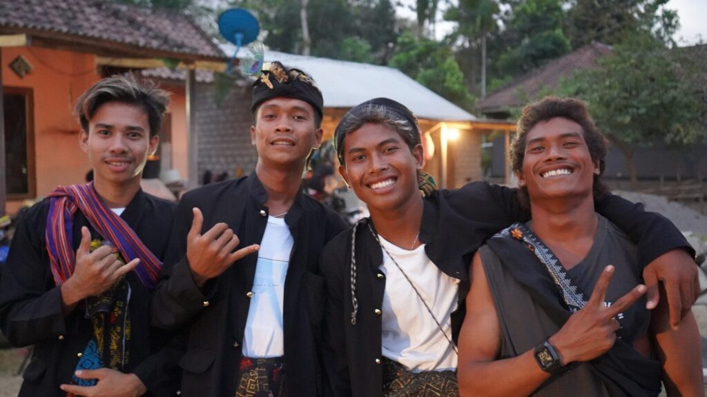 A group of young men standing next to each other