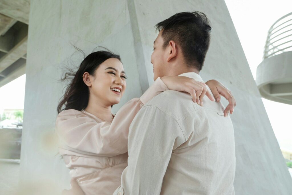 a man and a woman standing next to each other