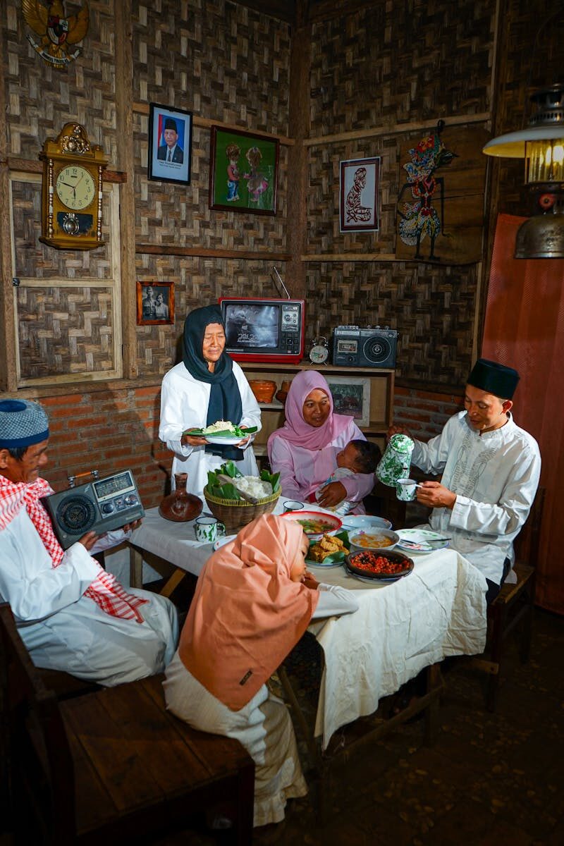 A warm family meal shared in a rustic and traditional setting, capturing a moment of togetherness and culture.
