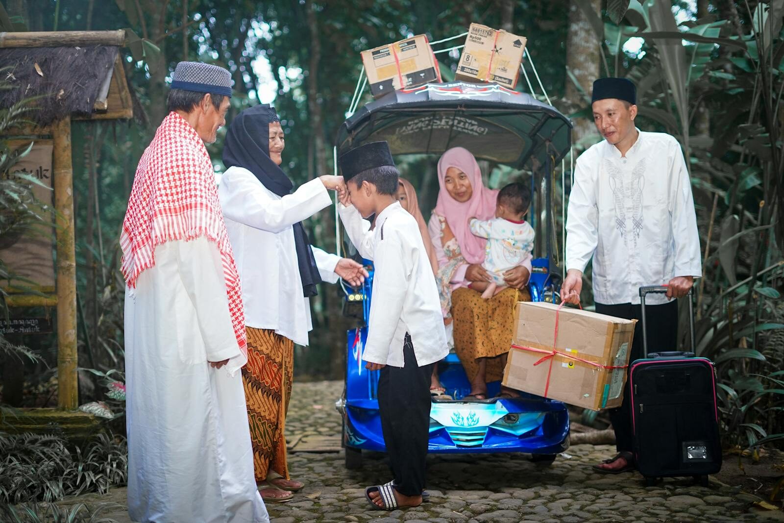 A heartfelt family reunion, highlighting traditional attire and cultural values in an outdoor setting.