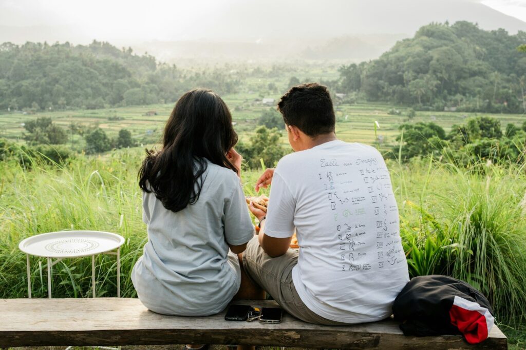 Two people enjoy the beautiful scenic view.