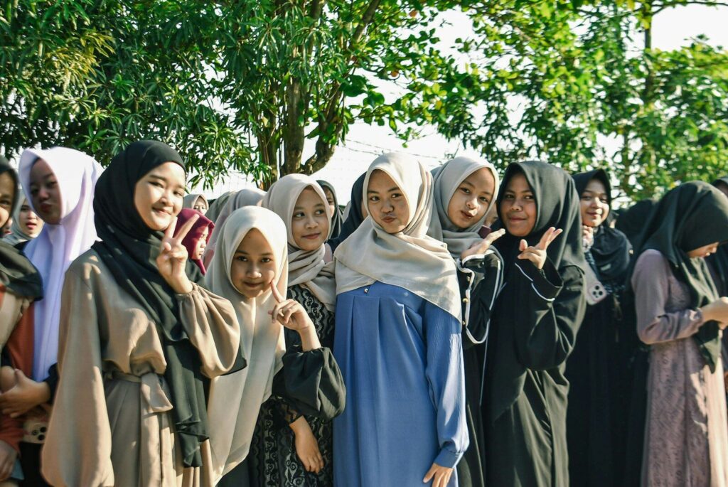 Group of young women wearing hijabs smiling